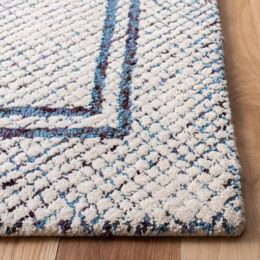 Abstract Ivory/Navy Doormat 2 Ft. X 3 Ft. Border Geometric Area Rug